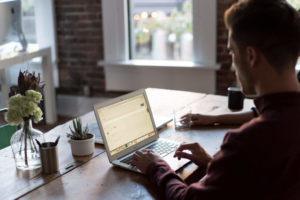 Man working on his desk. Photo by Bench Accounting