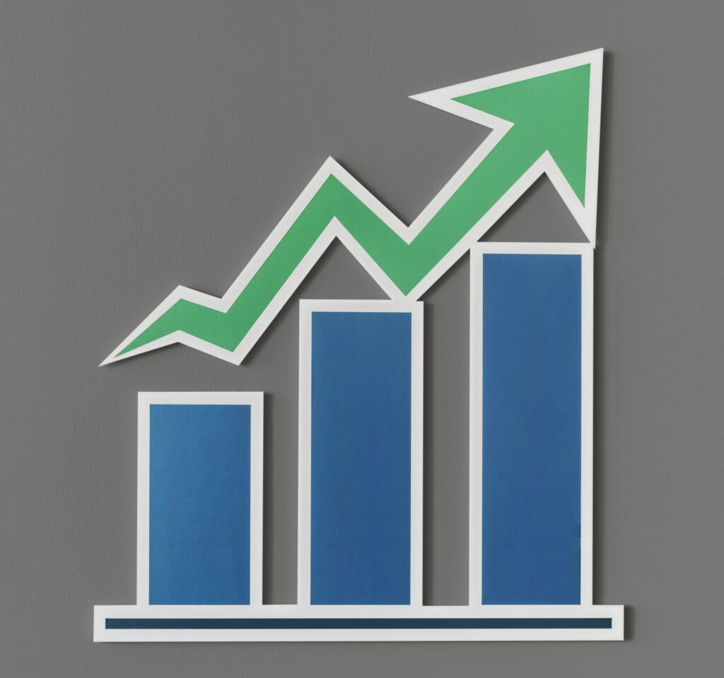 Three blue vertical bars of increasing height with a green upward arrow suggest growth or a positive trend—perfect for illustrating Google ranking higher; all elements appear as cut-out graphics on a gray background.