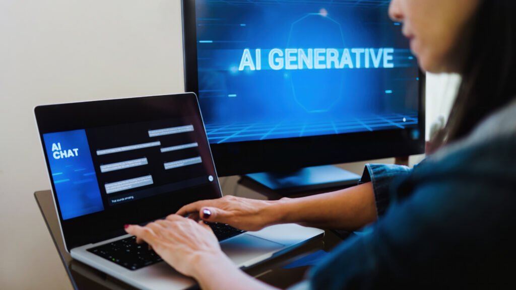 A person with an AI-driven mindset types on a laptop displaying an AI chat interface, while a monitor in the background shows the words "AI GENERATIVE.