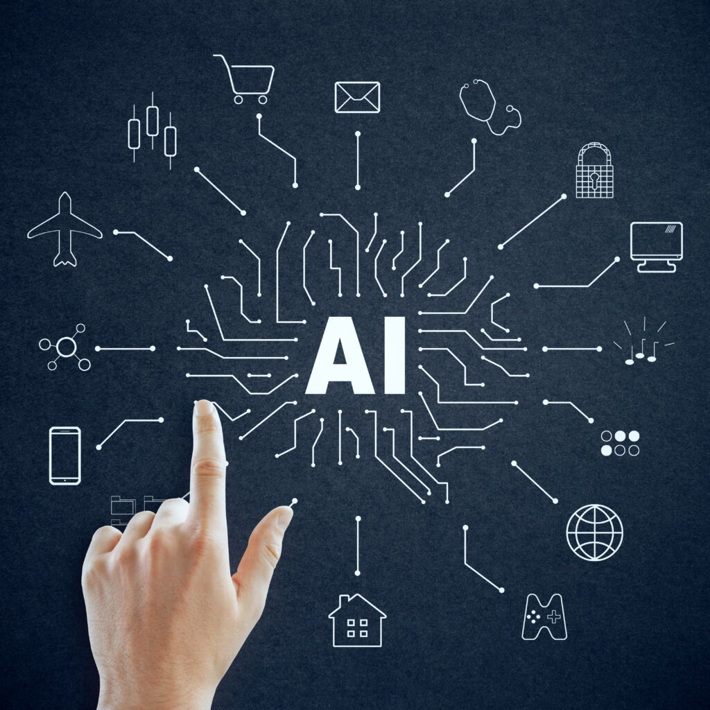 A hand points to the word "AI" at the center of a blackboard, surrounded by icons of industries and technologies, highlighting how small business AI is connecting sectors through innovation.