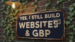 A metal sign on a brick wall with ivy reads, "YES, I STILL BUILD WEBSITES & GBP," illuminated by an outdoor light—highlighting expertise in websites and GBP services.